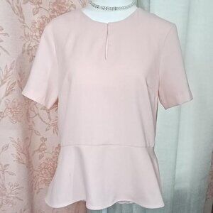 Baby doll blouse in a soft pink color
